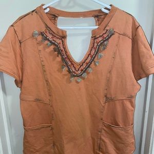 Orange tunic with beaded details and embroidery